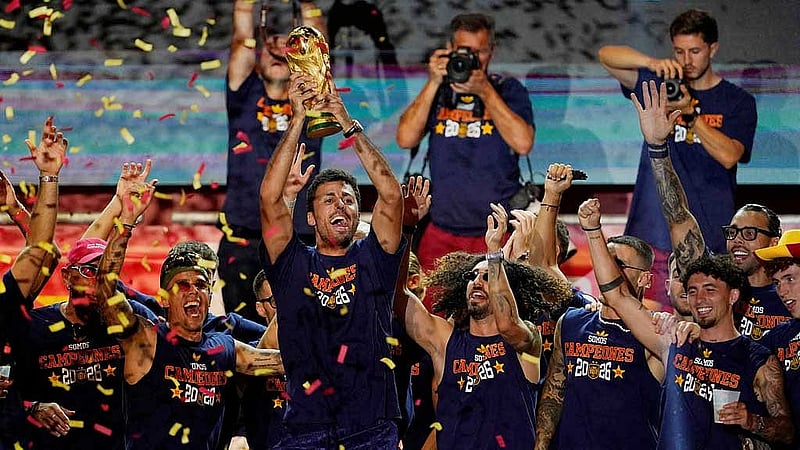 FIFA World Cup 2026 - Spain Victory Parade - Madrid, Spain - Jul 20, 2026 Spain's Rodri celebrates with the World Cup trophy and teammates on stage at Cibeles Square in Madrid after the victory parade as fans gather to celebrate winning the World Cup REUTERS/Ana Beltran