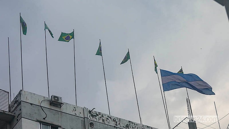 Flags of competing World Cup nations flutter from rooftops across Dhaka as football fever grips the capital. Photo: Abdullah Al Momin