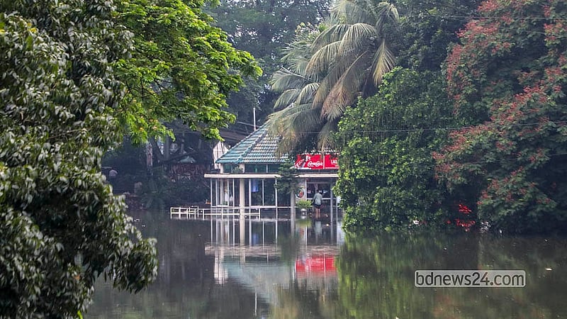 Continuous rain has left several structures around Dhanmondi Lake under water.  Photo: Abdullah Al Momin