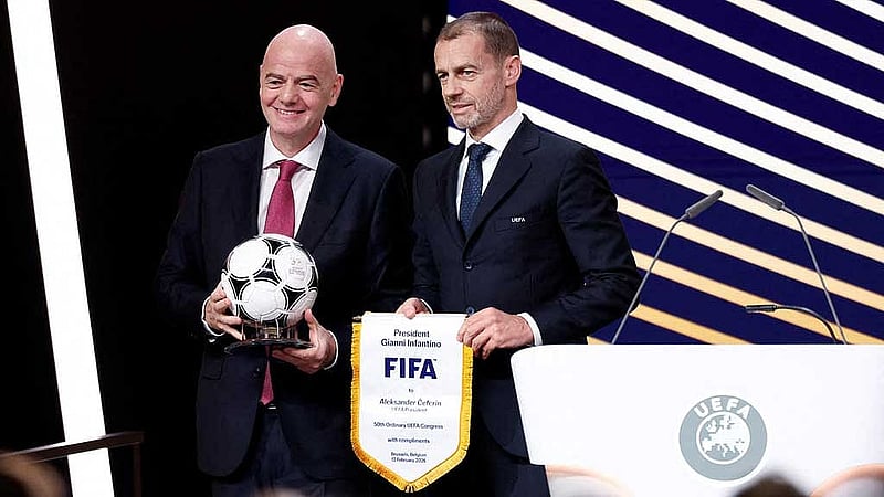FILE PHOTO: 50th Ordinary UEFA Congress - Brussels Expo, Brussels, Belgium - Feb 12, 2026 UEFA president Aleksander Ceferin and FIFA president Gianni Infantino pose for a photograph during the event REUTERS/Benoit Tessier/File Photo