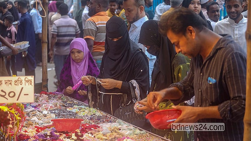 A fair is organised around the boat race at Nawabbari Pond in Old Dhaka’s Islampur. Photo: Abdullah Al Momin