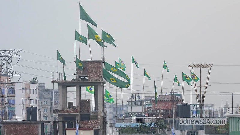 Flags of competing World Cup nations flutter from rooftops across Dhaka as football fever grips the capital. Photo: Abdullah Al Momin