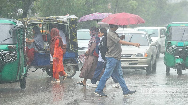 City dwellers rush to their destinations with umbrellas overhead as seen in Dhaka's Rampura on the afternoon of Monday, Aug 3, 2026. Photo: Shamsul Haque Ripon