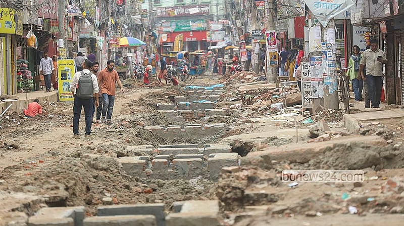 Sewerage works leave Khilgaon-Basabo road pockmarked with deep holes and potholes.  Photo: Shamsul Haque Ripon