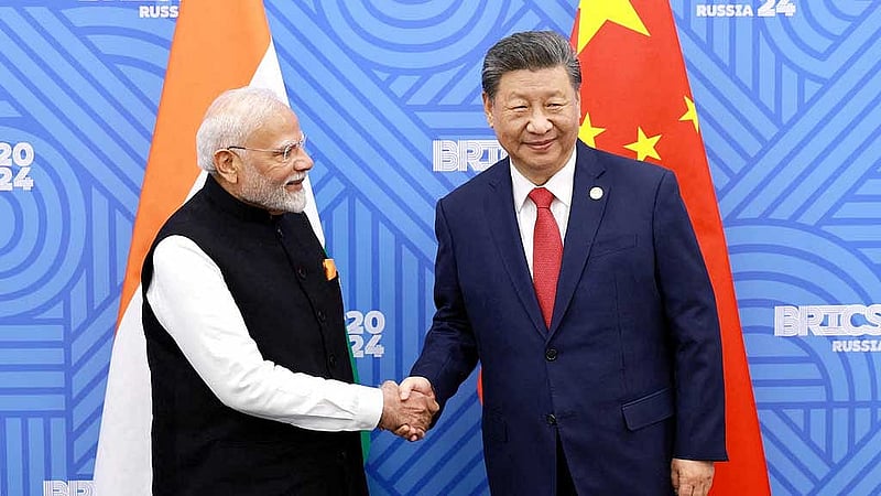Chinese President Xi Jinping and India Prime Minister Narendra Modi meet on the sidelines of the BRICS summit in Kazan, Russia Oct 23, 2024. China Daily via REUTERS