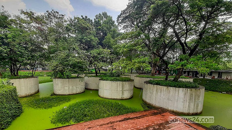 As part of the renovation, a water body has been built in Dhaka's Osmani Udyan. It is surrounded by trees. Photo: Abdullah Al Momin