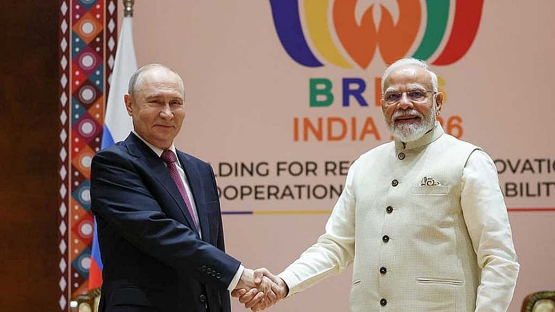 Russian President Vladimir Putin shakes hands with Indian Prime Minister Narendra Modi during a meeting on the sidelines of the BRICS summit in New Delhi, India, Sept 11, 2026. Sputnik/Alexander Kazakov/Pool via REUTERS