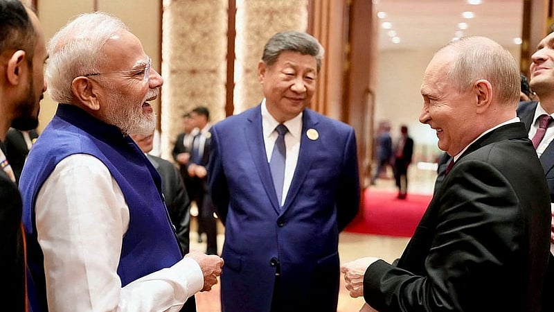 India's Prime Minister Narendra Modi shares a moment with Russian President Vladimir Putin as Chinese President Xi Jinping looks on during day two of the BRICS Summit in New Delhi, India, September 13, 2026. Photo: Reuters