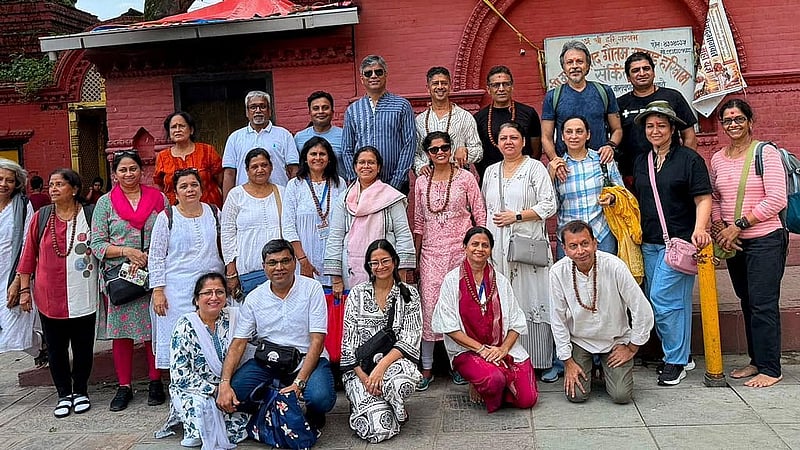 Arushi Gupta, 33, an Indian national, poses for a photograph with a group of pilgrims outside a temple in Kathmandu, Nepal, in this image shared with her father Aug 24, 2026. Gupta went missing while crossing from Nepal into Tibet during a pilgrimage to Mount Kailash, a sacred Hindu site, after deadly flash floods and mudslides struck the region. Gupta Family/Handout via REUTERS