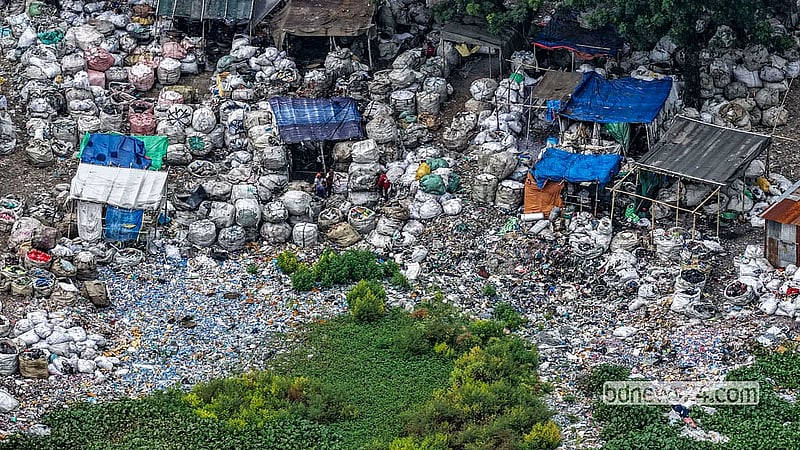 An unauthorised plastic sorting and processing centre has grown along the Buriganga bank in Islampur. Much of the waste brought here for recycling ends up being dumped directly into the river. Photo: Mostafigur Rahman