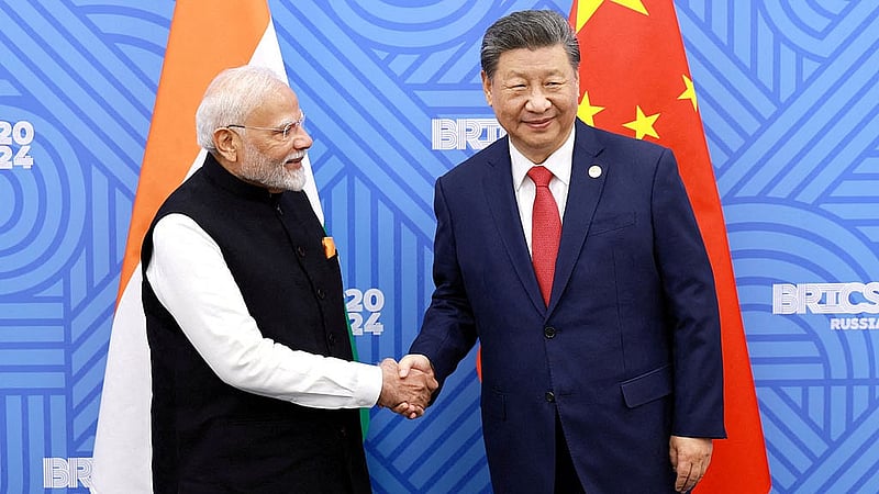 FILE PHOTO: Chinese President Xi Jinping and India Prime Minister Narendra Modi meet on the sidelines of the BRICS summit in Kazan, Russia Oct 23, 2024. China Daily via REUTERS
