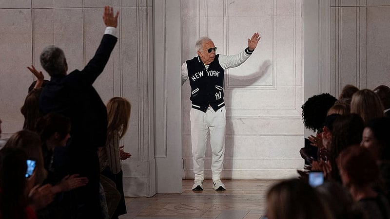 Designer Ralph Lauren waves to applause after presenting creations from his latest collection in Manhattan, New York City, US, Sept 9, 2026. REUTERS/Caitlin Ochs