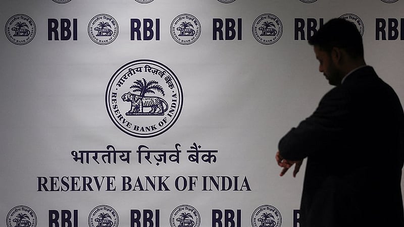 A man stands in front of the Reserve Bank of India (RBI) logo inside its headquarters in Mumbai, India, Feb 6, 2026. REUTERS/Francis Mascarenhas