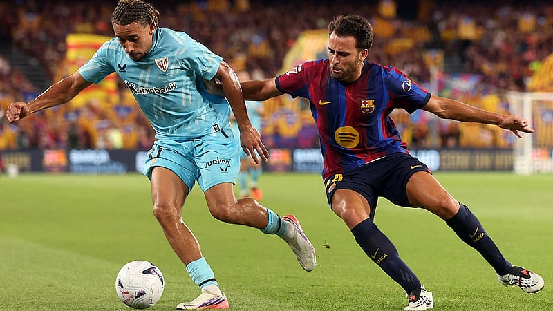 Football - LaLiga - FC Barcelona v Athletic Club - Spotify Camp Nou, Barcelona, Spain - Aug 27, 2026 Athletic Club&amp;amp;#39;s Johaneko Louis Jean in action with FC Barcelona&amp;amp;#39;s Eric Garcia REUTERS/Bruna Casas