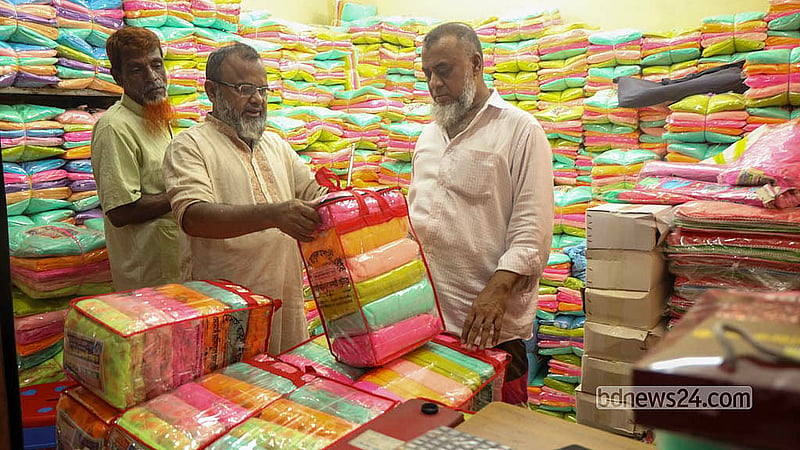 Buyers browse and buy nets at the Bhulta Gausia wholesale market as demand rises across Bangladesh.   Photo: Shamsul Haque Ripon