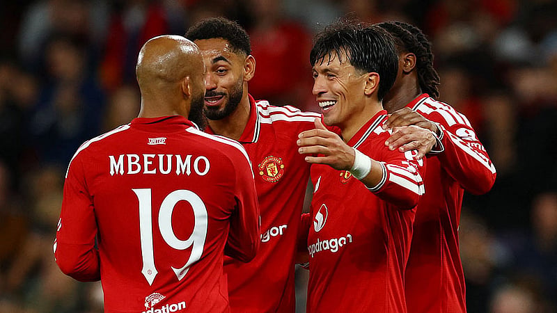 Football - UEFA Champions League - Manchester United v Sabah - Old Trafford, Manchester, Britain - September 10, 2026 Manchester United's Lisandro Martinez celebrates scoring their fourth goal with teammates REUTERS