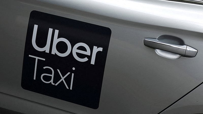 The Uber logo is seen on the side of a taxi, in Dublin, Ireland, Jun 29, 2025. REUTERS/Clodagh Kilcoyne/File Photo
