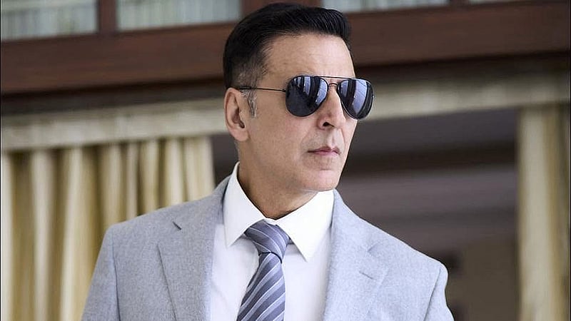 Akshay Kumar poses in a sharp grey suit paired with sunglasses. Photo: Akshay Kumar/ Facebook