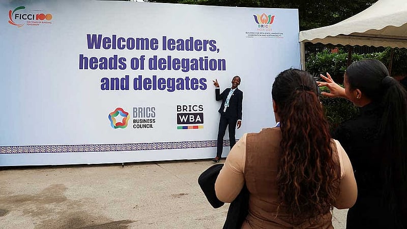 Delegates from South Africa take pictures outside Bharat Mandapam, the venue of the upcoming 18th BRICS Summit in New Delhi, India, September 11, 2026. REUTERS