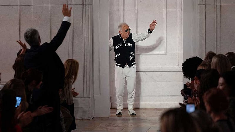 Designer Ralph Lauren waves to applause after presenting creations from his latest collection in Manhattan, New York City, US, Sept 9, 2026. REUTERS/Caitlin Ochs