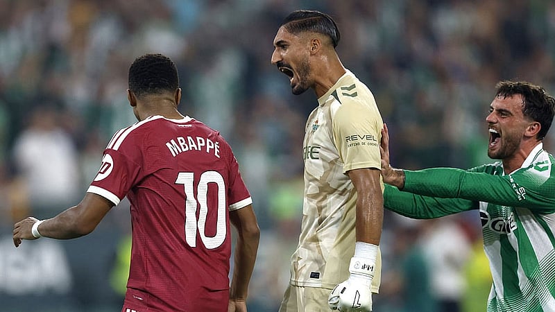 Football - LaLiga - Real Betis v Real Madrid - Estadio La Cartuja, Seville, Spain - September 4, 2026 Real Betis' Alvaro Valles celebrates saving the penalty from Real Madrid's Kylian Mbappe REUTERS