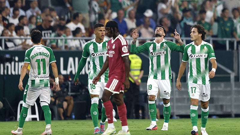 Football - LaLiga - Real Betis v Real Madrid - Estadio La Cartuja, Seville, Spain - September 4, 2026 Real Betis' Troy Parrott celebrates scoring their first goal with teammates REUTERS
