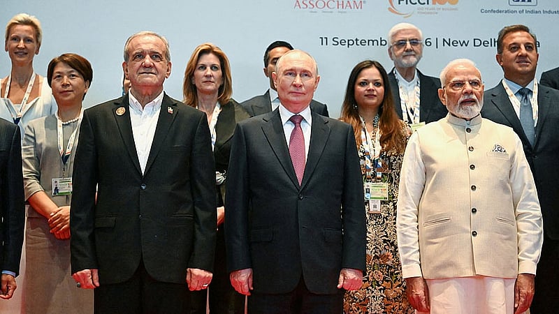 Officials, including Russian President Vladimir Putin, Indian Prime Minister Narendra Modi and Iranian President Masoud Pezeshkian, pose for a picture during a photo session for participants in the BRICS Business Forum and the BRICS Women's Business Alliance in New Delhi, India, September 11, 2026. Sputnik/Dmitry Azarov/Pool via REUTERS