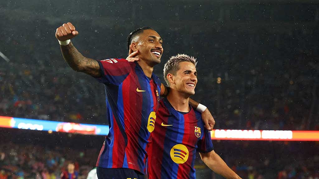 Flick sets record as Barcelona breeze past Racing with Raphinha hat-trick