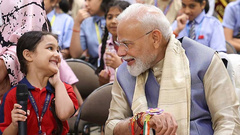 Narendra Modi celebrates Raksha Bandhan with school children in New Delhi. Photo: Narendra Modi/ Facebook