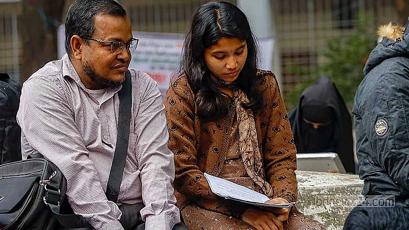 A student studies on the Dhaka University campus.