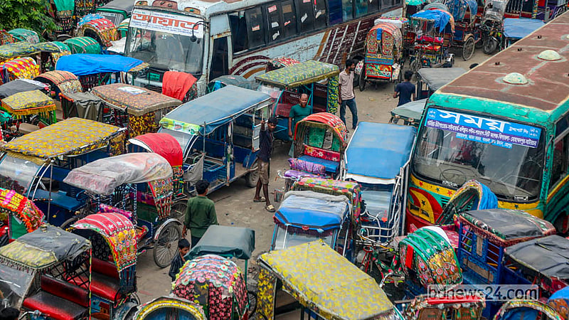 Several people search for their seized rickshaws at the dumping station beside Postogola Bridge in Dhaka’s Shyampur. Photo: Abdullah Al Momin