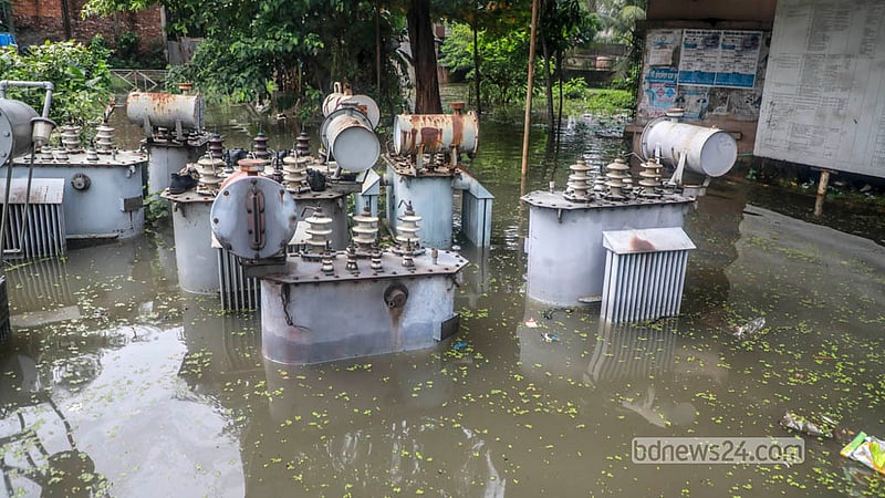 A transformer stands surrounded by floodwater at the DPDC office in Jatrabari’s Matuail after heavy rain early Sunday, Sept 20, 2026.   Photo: Abdullah Al Momin