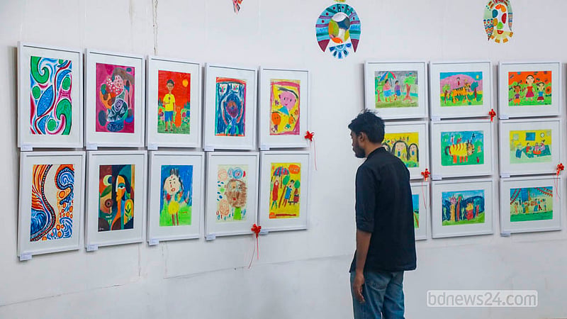A visitor browses the Children’s Art Exhibition at the Zainul Gallery of Dhaka University's Faculty of Fine Art.   Photo: Abdullah Al MominA visitor browses the Children’s Art Exhibition at the Zainul Gallery of Dhaka University's Faculty of Fine Art.   Photo: Abdullah Al Momin