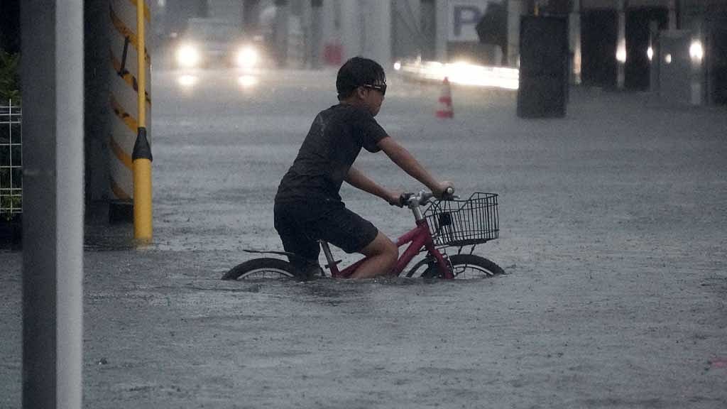 Torrential rains brought by Japan typhoon kill two, NHK says
