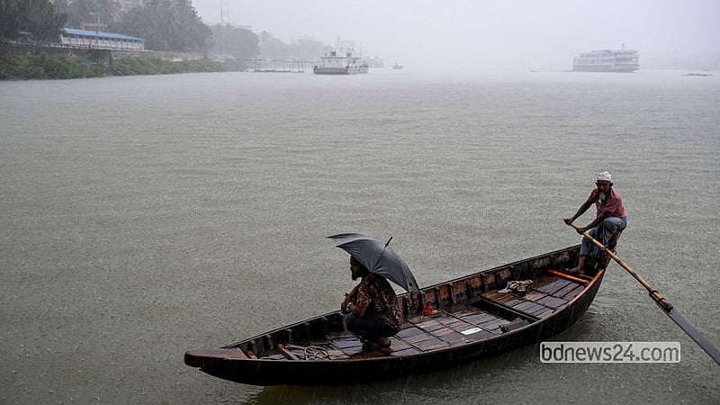 Rain-soaked and busy, a boatman carries passengers across the Buriganga at Shyambazar in Old Dhaka on an Ashwin afternoon. Photo: Mostafigur Rahman