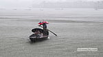 Rain sweeps across the Buriganga
