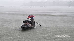 Rain sweeps across the Buriganga