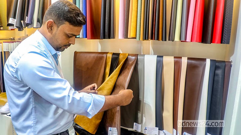A man looks at processed leather. The leather and footwear industry exhibition at International Convention City Bashundhara in the Kuril area of Dhaka will run until Saturday, Sept 26, 2026.  Photo: Abdullah Al Momin
