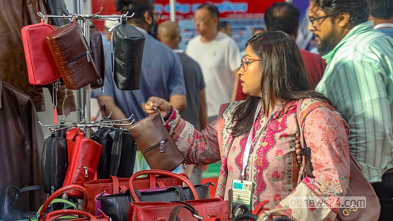 Visitors browse a number of stalls during the leather and footwear industry exhibition, with many buying pieces that catch their attention.  Photo: Abdullah Al Momin