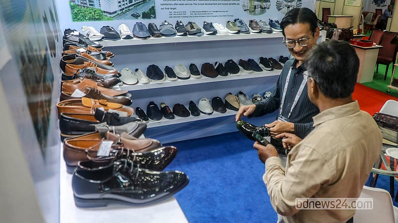 Visitors view leather products at a stall during the leather and footwear industry exhibition at International Convention City Bashundhara in the Kuril area of Dhaka.  Photo: Abdullah Al Momin