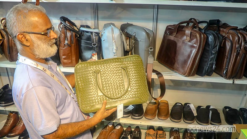 Visitors view leather products at a stall during the leather and footwear industry exhibition at International Convention City Bashundhara in the Kuril area of Dhaka.  Photo: Abdullah Al Momin