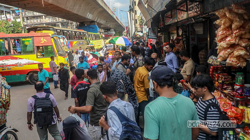 Passengers wait outside Fulbaria Inter-district Bus Terminal in Dhaka. Photo: Abdullah Al Momin