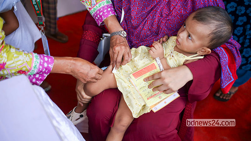 A health worker vaccinates a child at the T&amp;T playground in Dhaka’s Karail on Saturday, Sept 26, 2026, the first day of a nationwide special measles and rubella vaccination campaign.