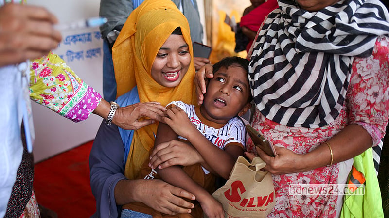 A health worker vaccinates a child at the T&amp;T playground in Dhaka’s Karail on Saturday, Sept 26, 2026, the first day of a nationwide special measles and rubella vaccination campaign.