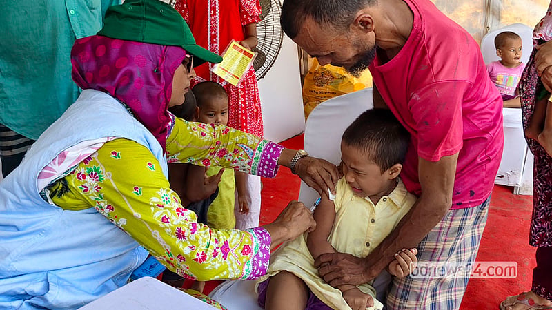 A health worker vaccinates a child at the T&amp;T playground in Dhaka’s Karail on Saturday, Sept 26, 2026, the first day of a nationwide special measles and rubella vaccination campaign.