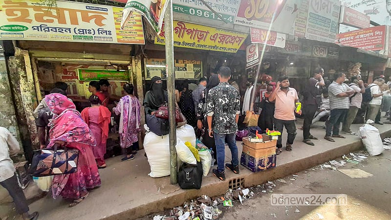 Passengers wait outside Fulbaria Inter-district Bus Terminal in Dhaka. Photo: Abdullah Al Momin