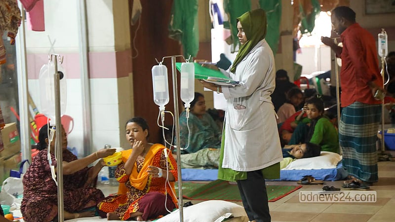 A duty nurse tends to a dengue patient at Mugda Medical College Hospital in Dhaka. Photo: Shamsul Haque Ripon