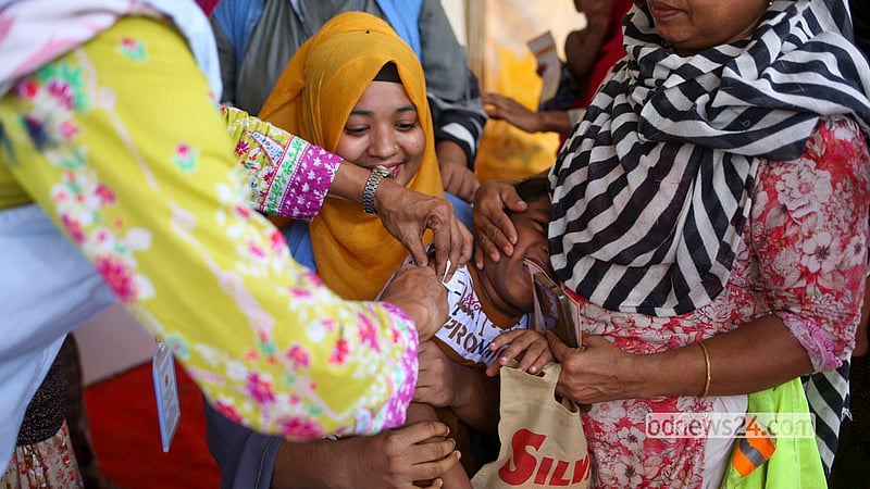 A health worker vaccinates a child at the T&amp;T playground in Dhaka’s Karail on Saturday, Sept 26, 2026, the first day of a nationwide special measles and rubella vaccination campaign.