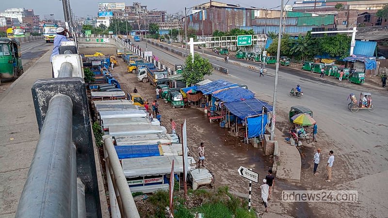 A large section of the playing field beside Postogola Bridge in northern Dhaka has been turned into a truck, pickup and Laguna stand. Photo: Abdullah Al Momin