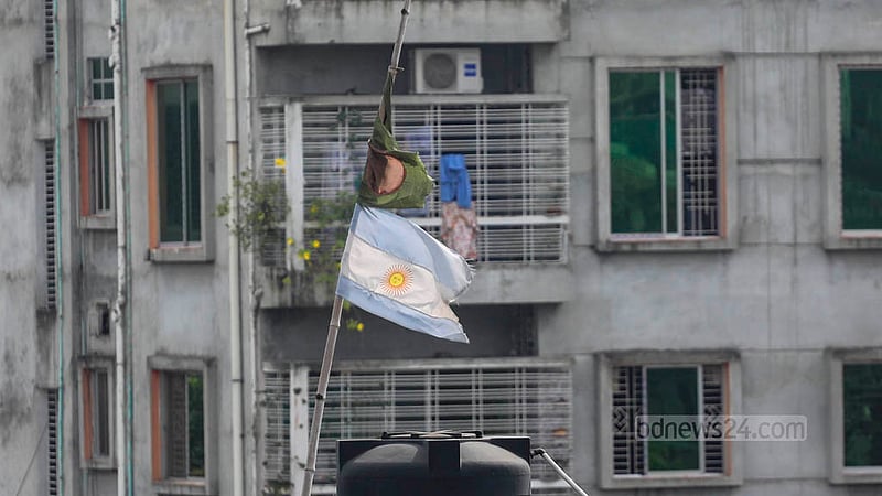 During the football World Cup, flags of different countries, including Bangladesh’s, were hoisted on rooftops across Dhaka. Months after the tournament ended, many remain in place, their colours faded and fabric torn by exposure to sun and rain. Under Bangladeshi law, displaying a torn, damaged, or faded national flag is an offence. Photo: Abdullah Al Momin